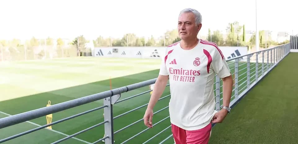Coach walking near training pitch in Madrid