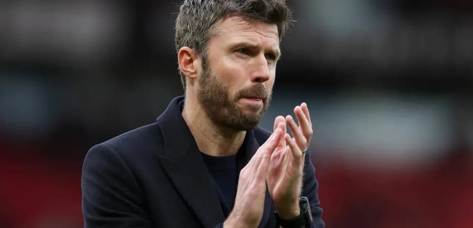 Coach clapping on the sidelines during a match