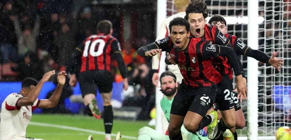 Bournemouth players celebrate a goal against Liverpool