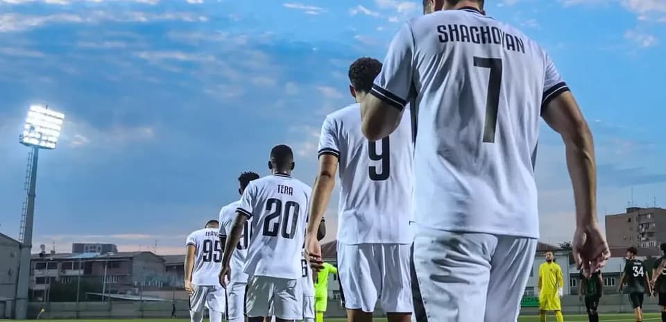 Players entering the field for UEFA match