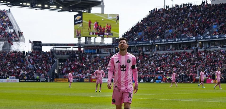 Lionel Messi walking on field during match