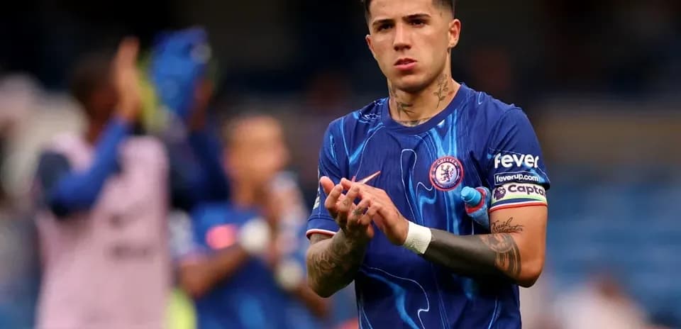 Player applauding fans in Chelsea kit