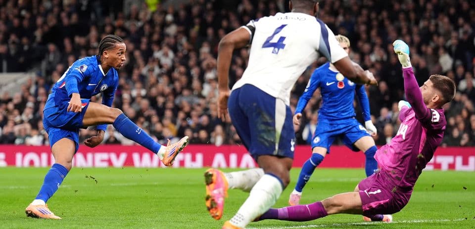 Chelsea player shooting at Tottenham goal