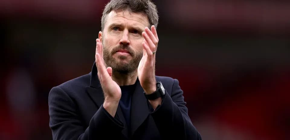 Coach applauding fans after the match