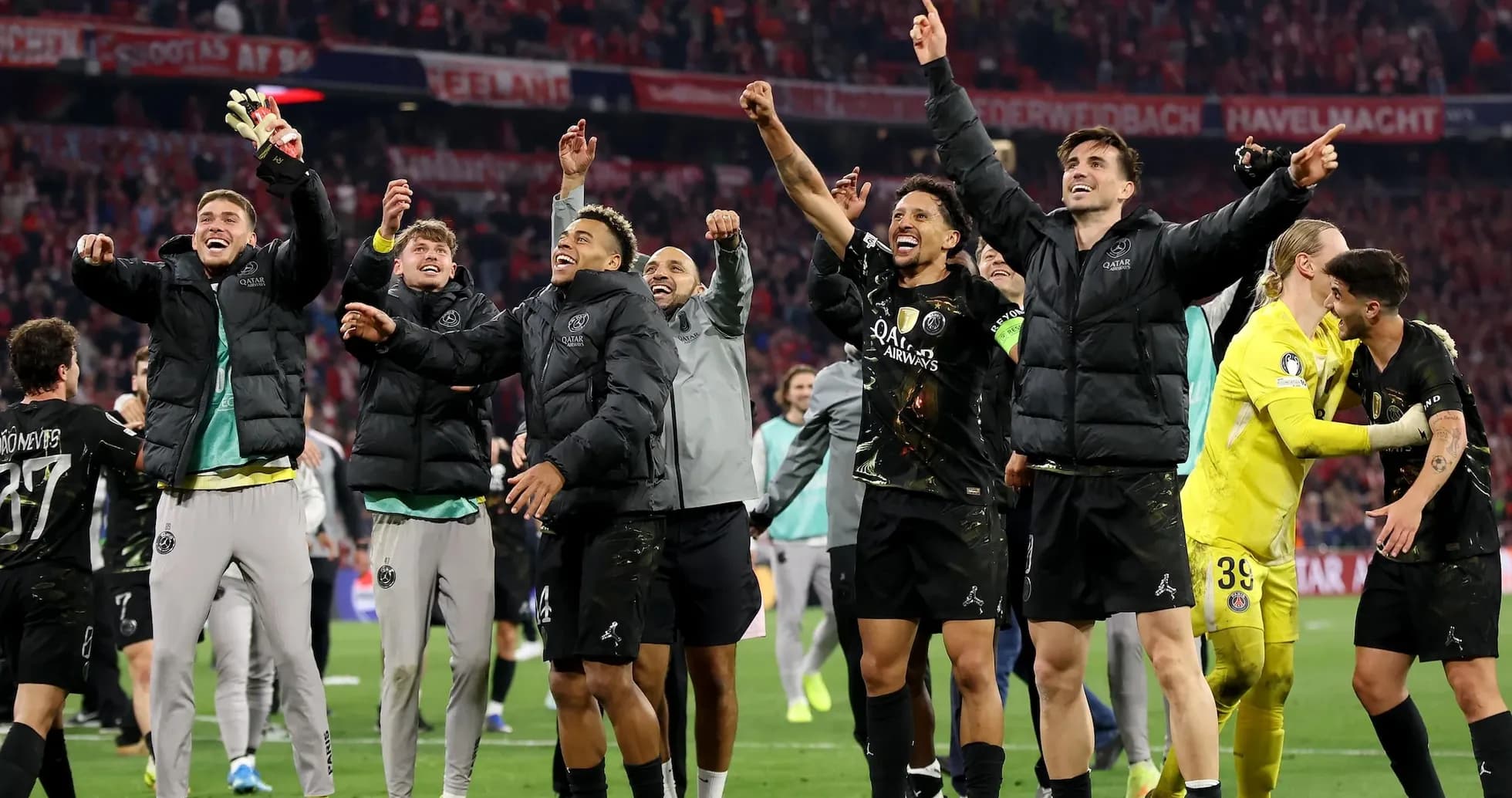 Players celebrating a victory on the pitch