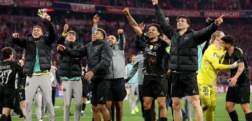 Players celebrating a victory on the pitch
