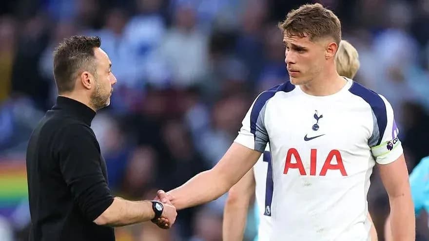 Coach shaking hands with player after match