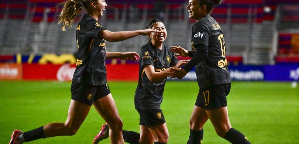 Players celebrating a goal during match