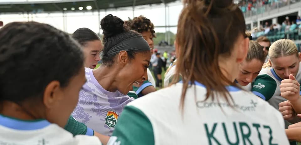 Players huddling before the match