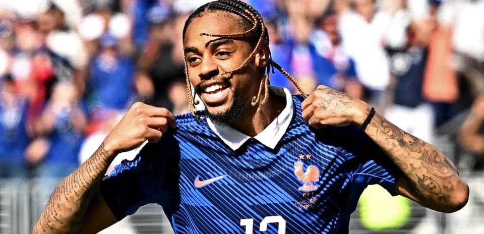 Player celebrating and showing jersey during match