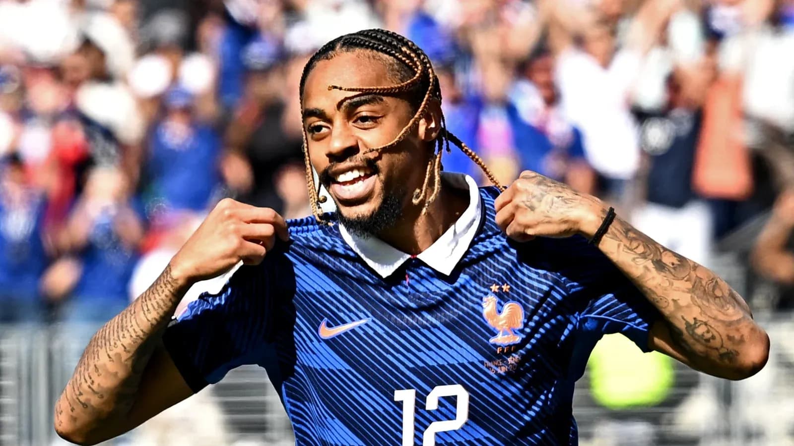 Player celebrating and showing jersey during match