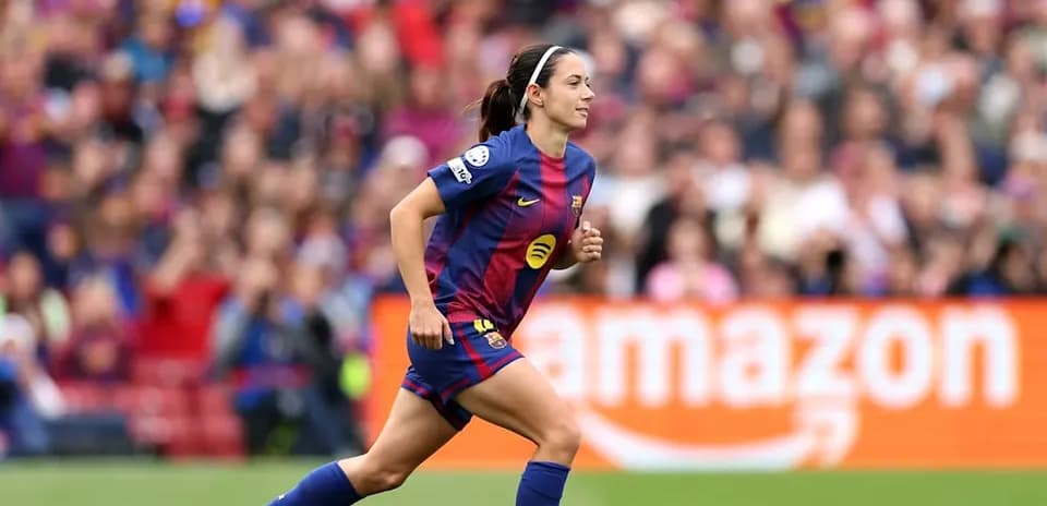 Barcelona player running during a match at stadium