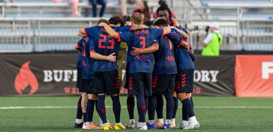 Loudoun United players in huddle before match