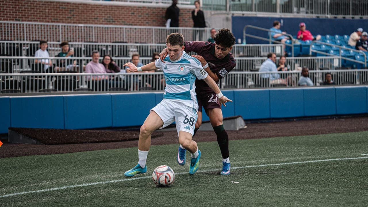 Player battling for possession during MLS Next Pro match