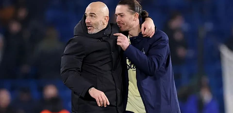 Coach and player celebrating after the match