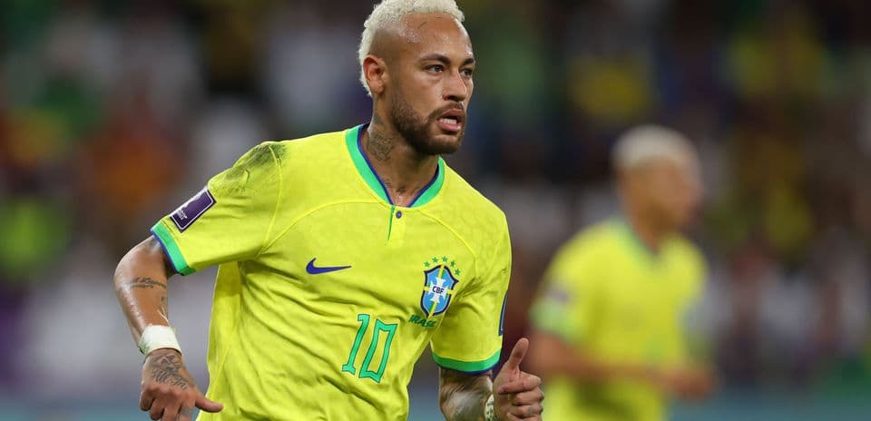 Neymar running in Brazil jersey during match