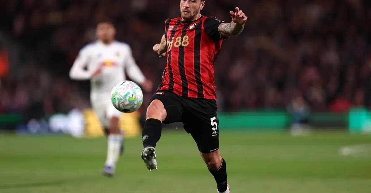 Player kicking ball during a football match