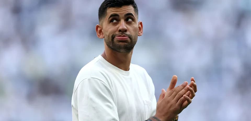 Player clapping and looking up during match