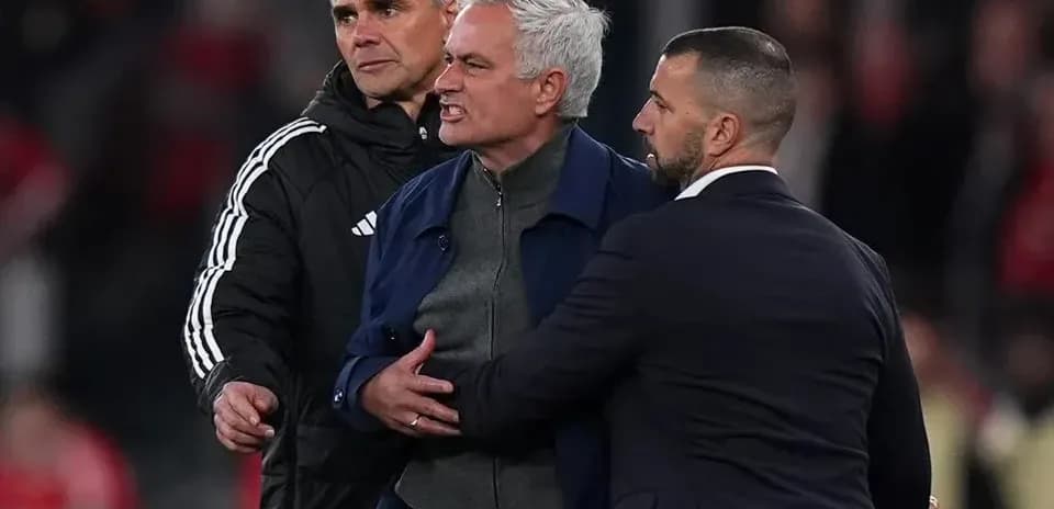 Manager being restrained by staff during confrontation
