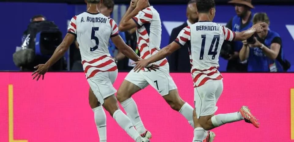 US players celebrating a goal during a match
