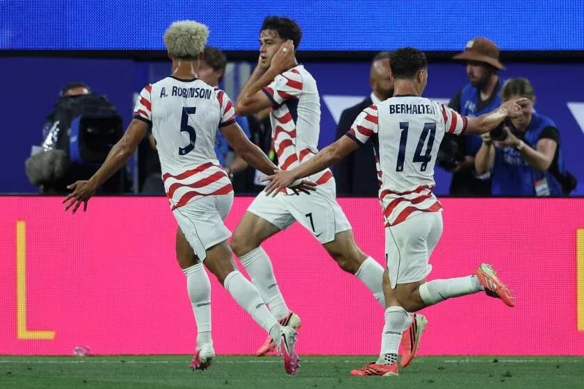 US players celebrating a goal during a match