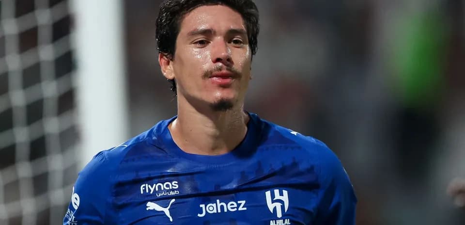 Player in blue jersey after match celebration