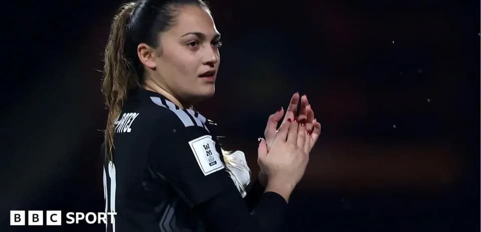 Goalkeeper clapping during a match celebration