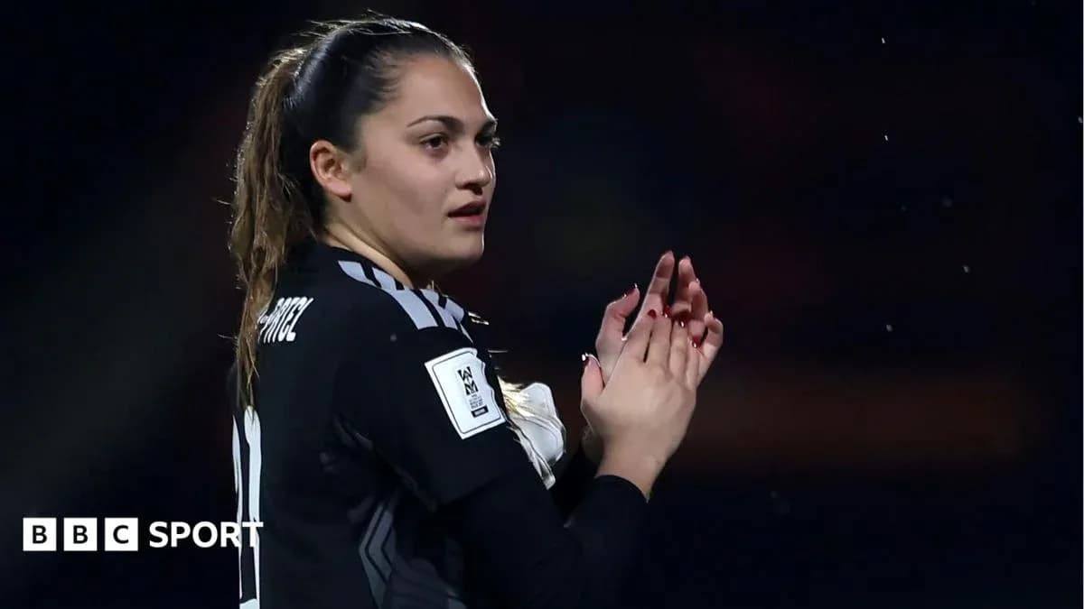 Goalkeeper clapping during a match celebration