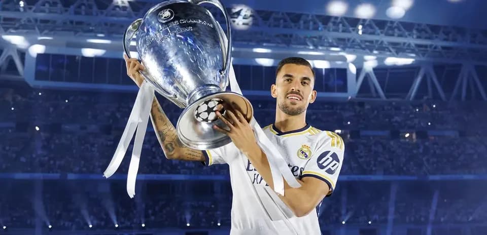 Player holding UEFA Champions League trophy in celebration