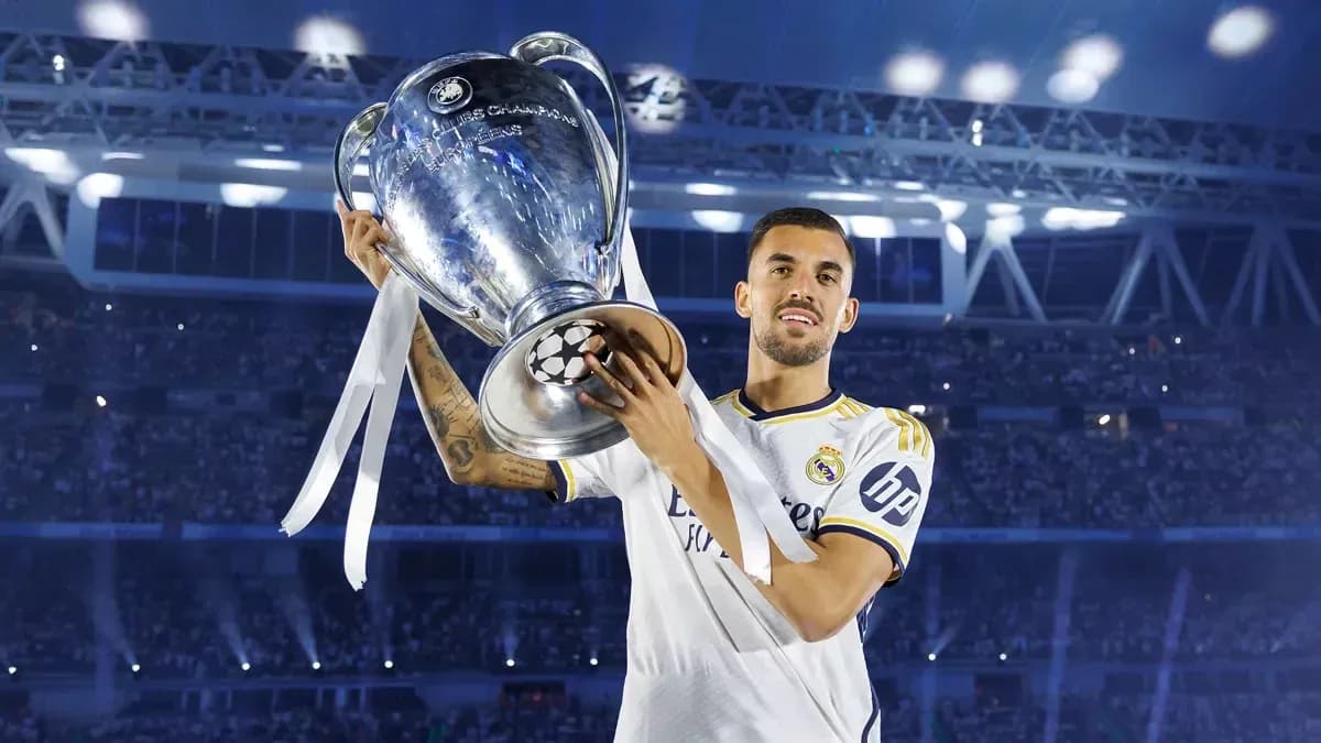 Player holding UEFA Champions League trophy in celebration