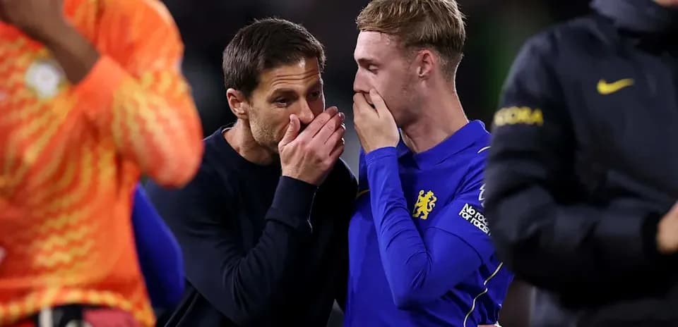 Coach and player discussing after the match