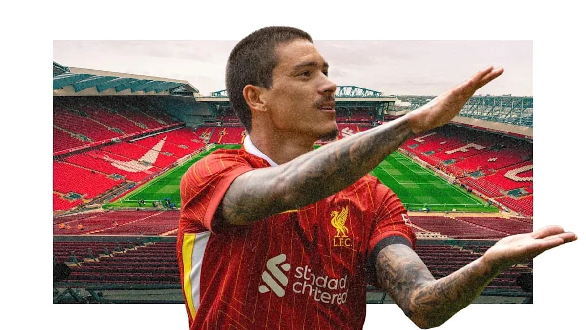 Player gesturing on the pitch at Anfield stadium