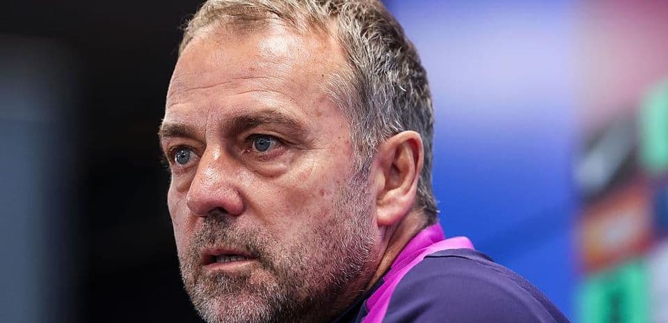 Coach speaking during a press conference
