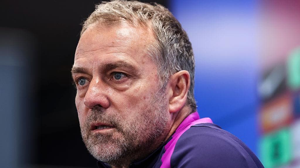 Coach speaking during a press conference