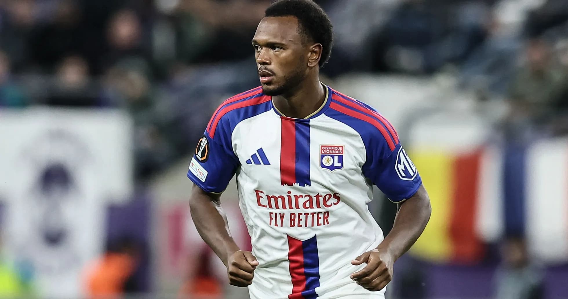 Player in Olympique Lyonnais jersey during match