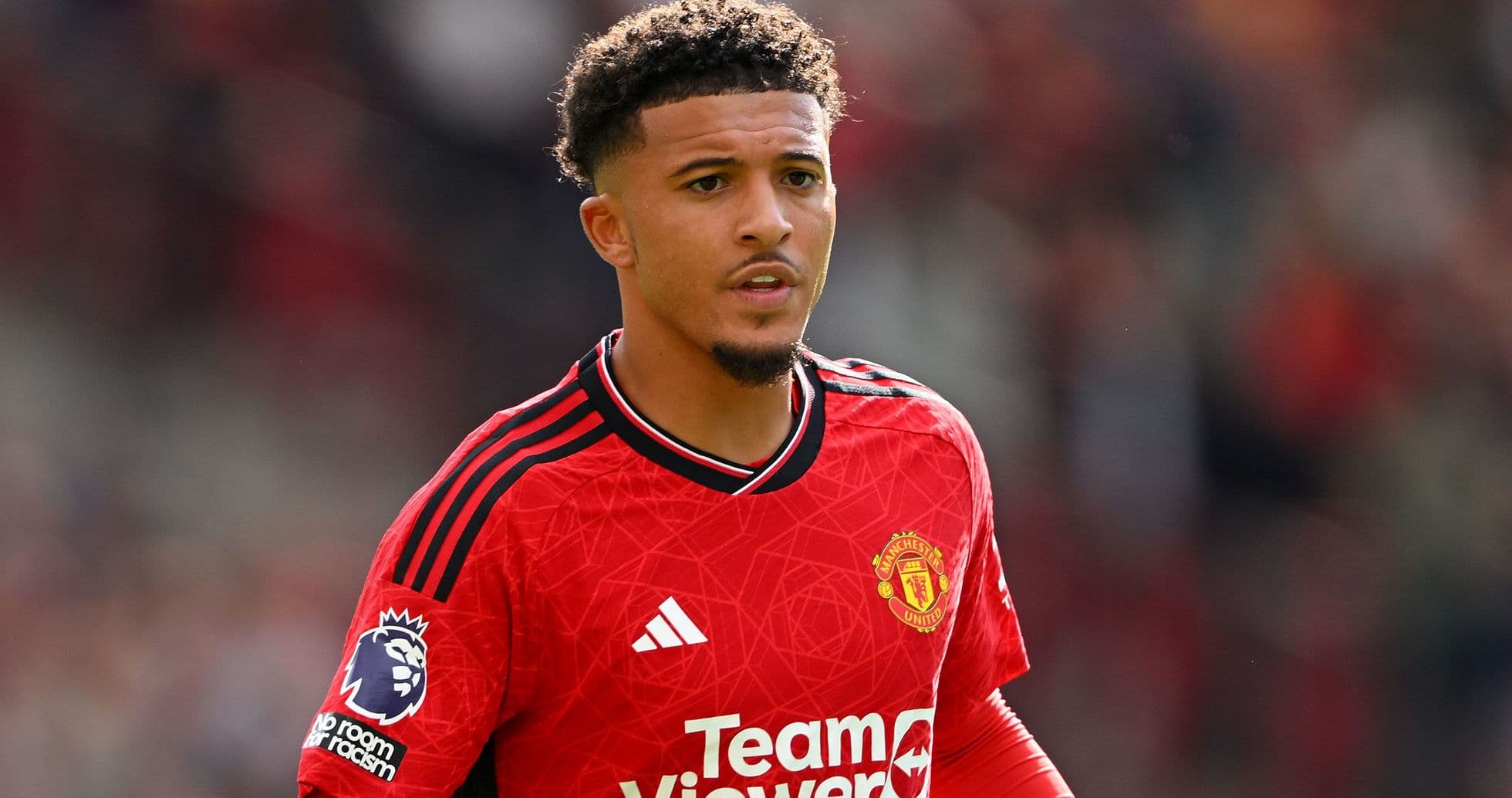 Player wearing Manchester United jersey on the field