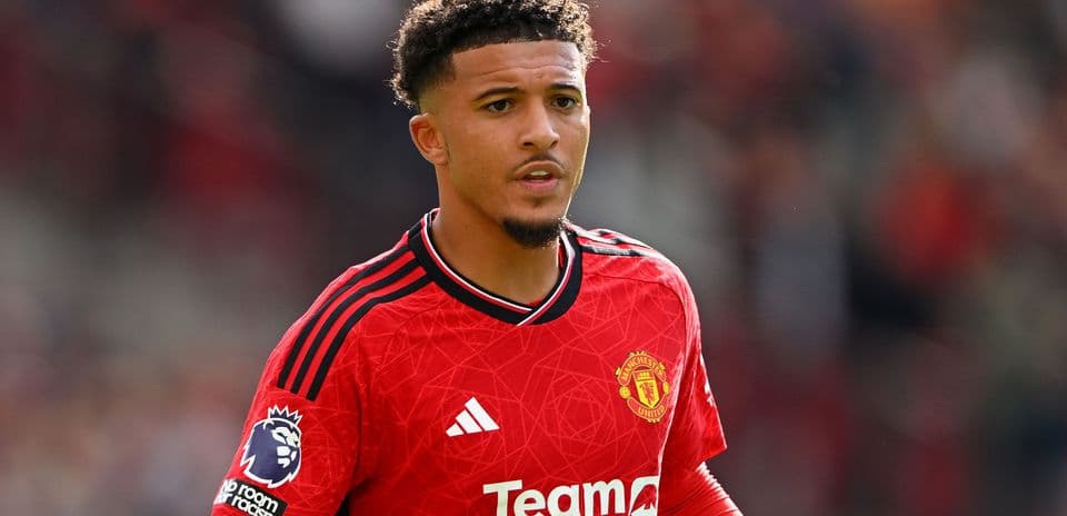 Player wearing Manchester United jersey on the field