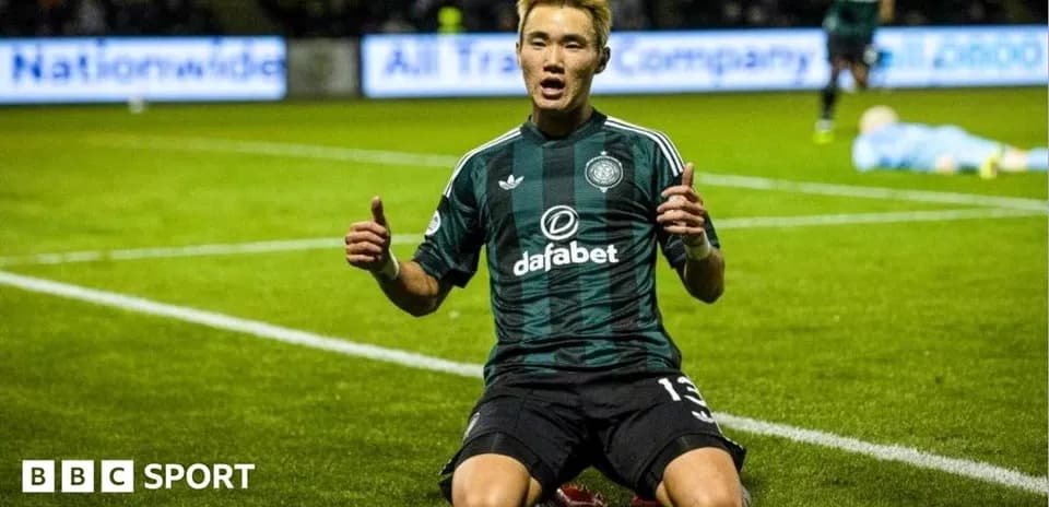 Player celebrating on the pitch after scoring goal