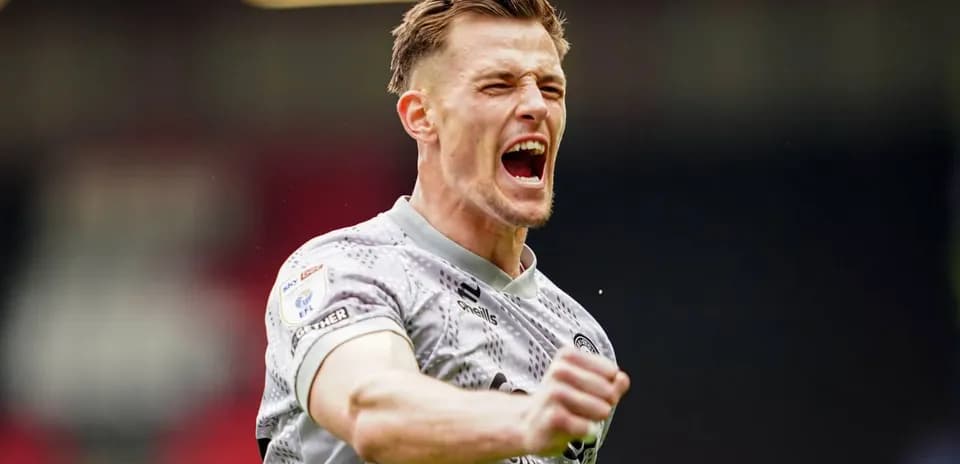 Player celebrating a goal with raised fist
