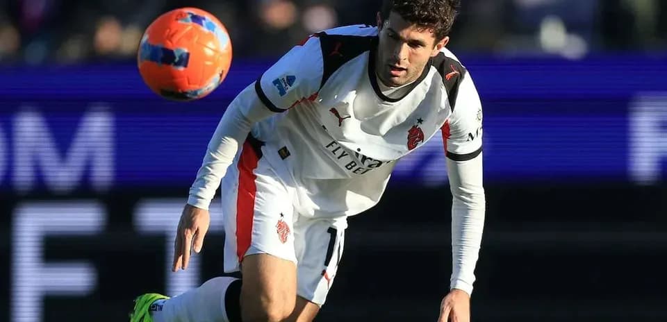 Player in action with ball during football match
