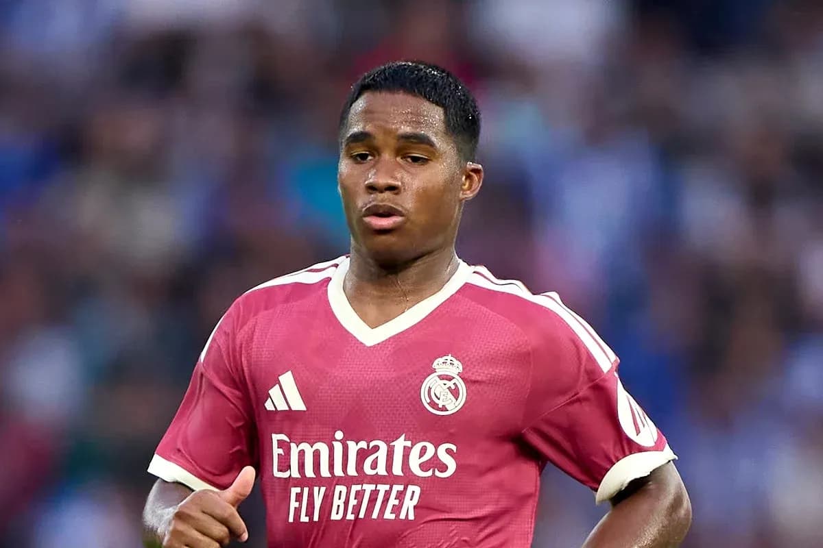 Player wearing pink Real Madrid jersey during match