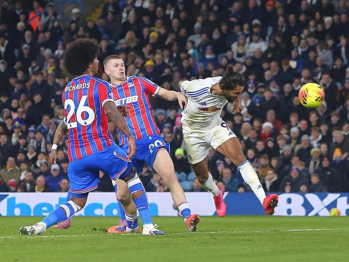 Leeds player heading the ball against Crystal Palace