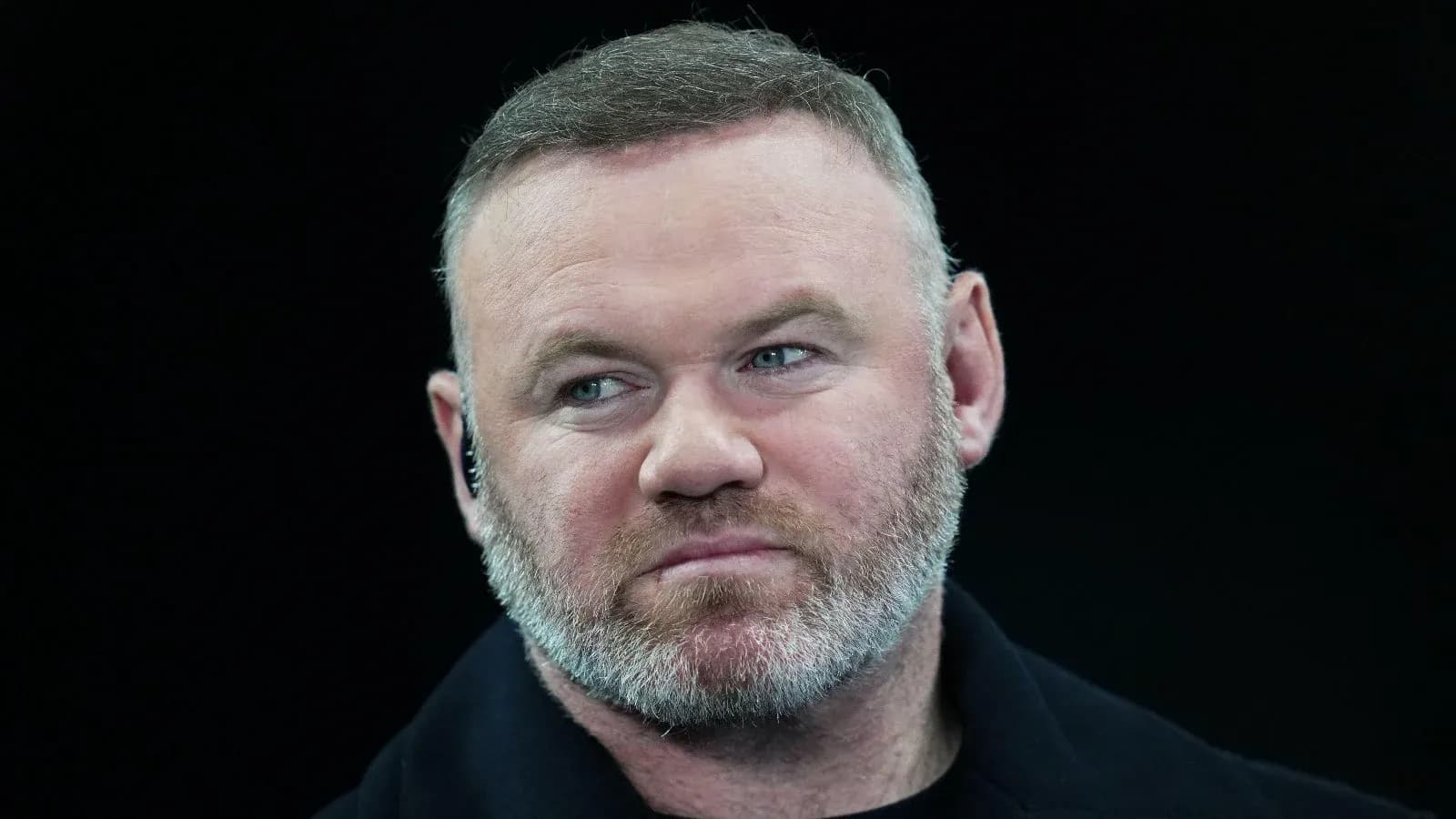 Close-up of a man with a beard and short hair