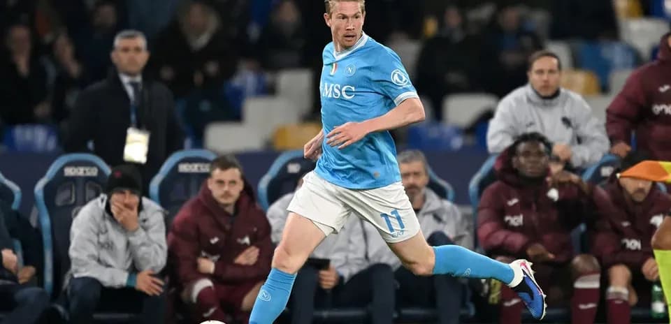 Player in blue kit running with the ball