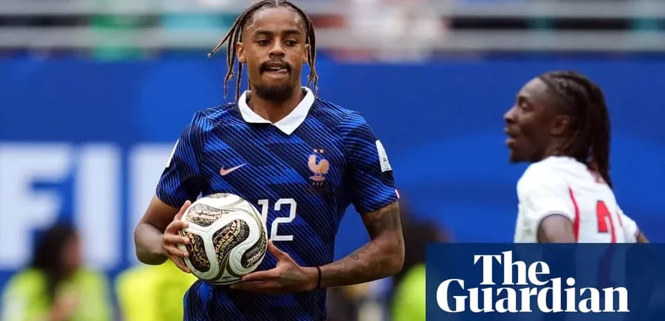 Player in France kit holding soccer ball on field