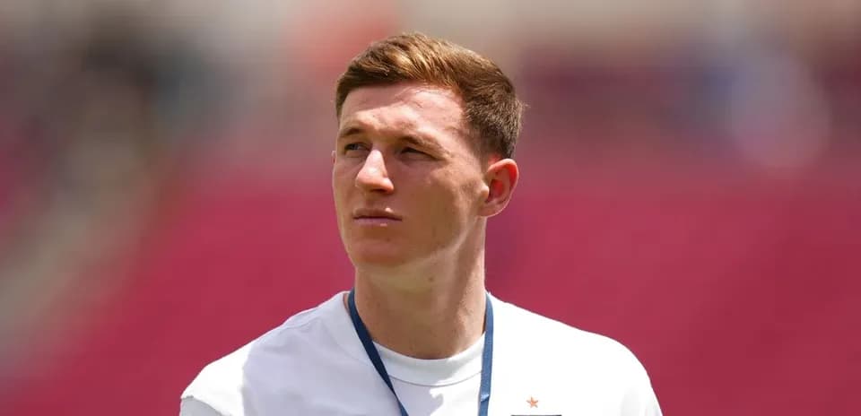 Player wearing England shirt on field before match