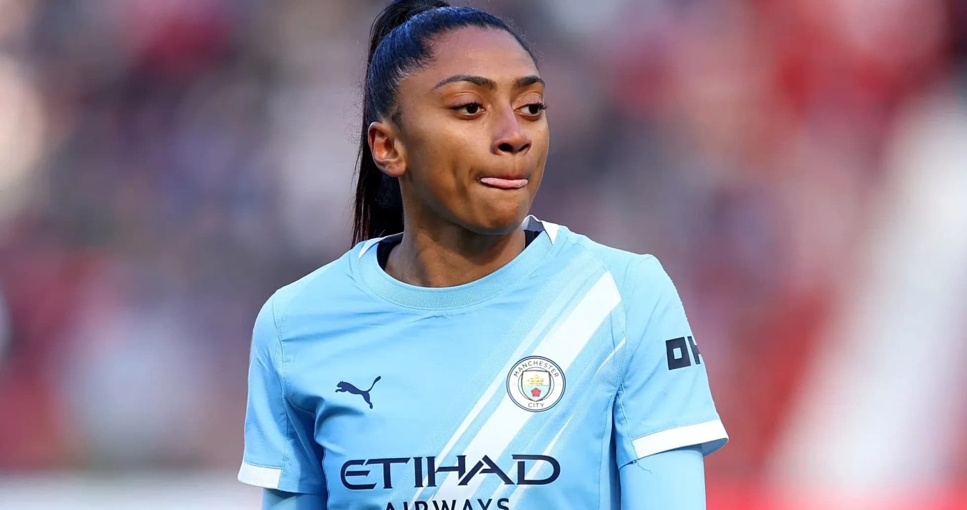 Female player in Manchester City kit during match