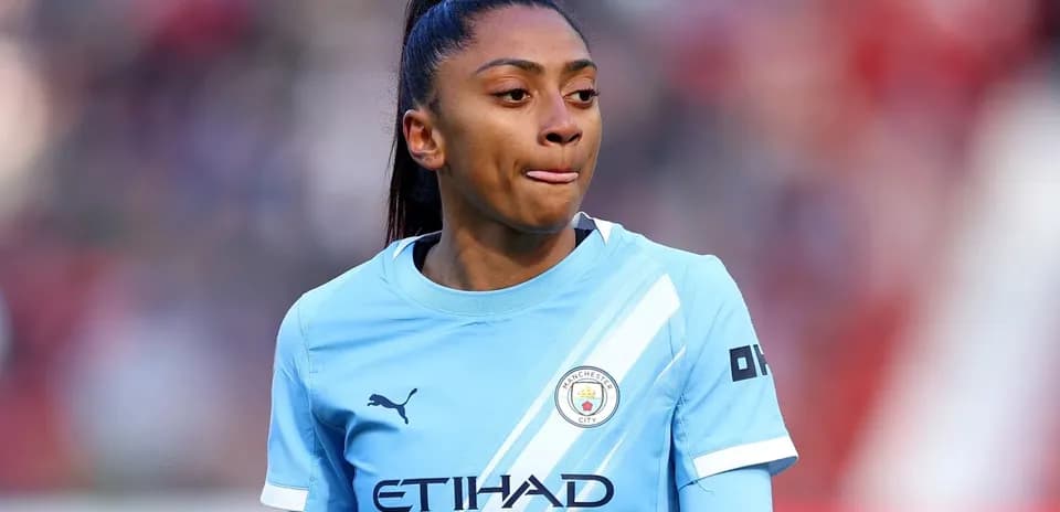 Female player in Manchester City kit during match