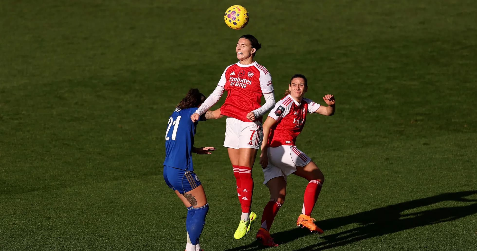 Arsenal W player competing for the ball