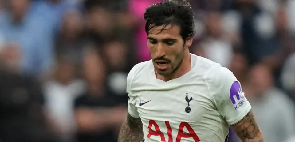 Player in Tottenham kit running during match